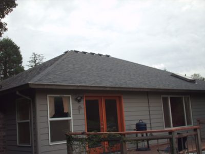 New roof over a home with a covered rear deck