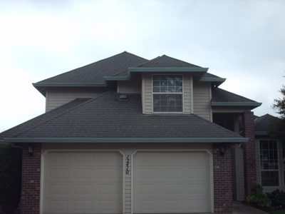 Completed roof replacement on a two-car garage and home