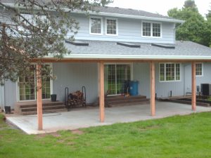 Covered patio addition running the length of a home