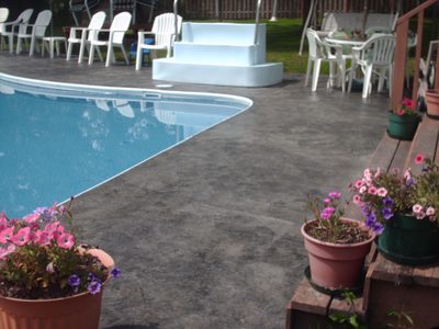 Poured concrete pool deck and surround